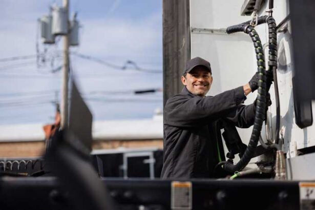 A truck driver stops at a gas station to refuel the rig in his fleet.